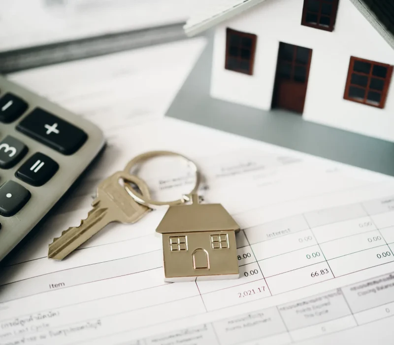 calculator-toy-house-and-key-on-finance-document-2026-01-08-05-33-48-utc