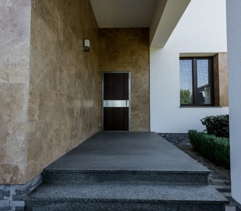 modern-home-entryway-with-brown-door-and-steps-2026-03-13-01-18-35-utc